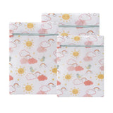 a set of two white and pink baby bed sheets with rainbows and clouds