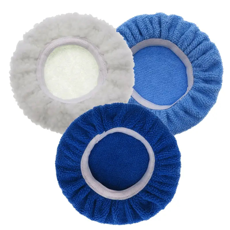 three blue and white baby hats with white clouds