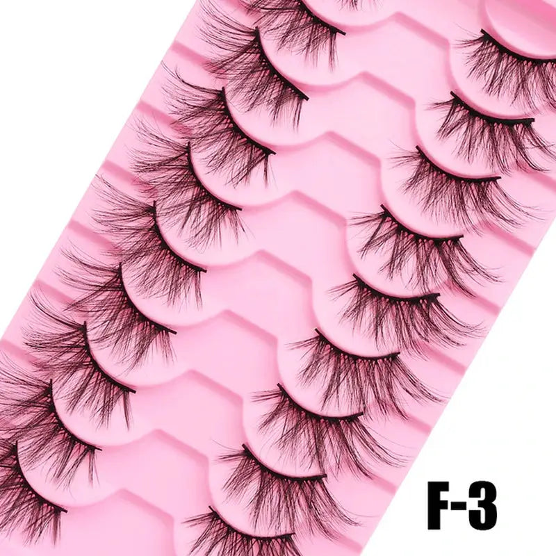 a close up of a pink tray with five pairs of false lashes