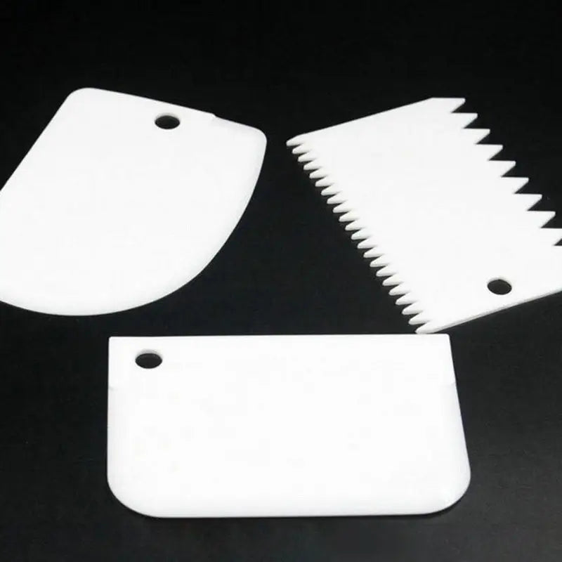 three pieces of plastic cutting board with a knife and a cutting board