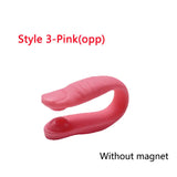 a pink plastic penis with a white background