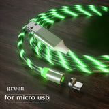a close up of a green and white usb cable on a table