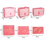 the pink cosmetic bag with gold lettering