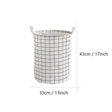 a white and black plaid fabric storage basket