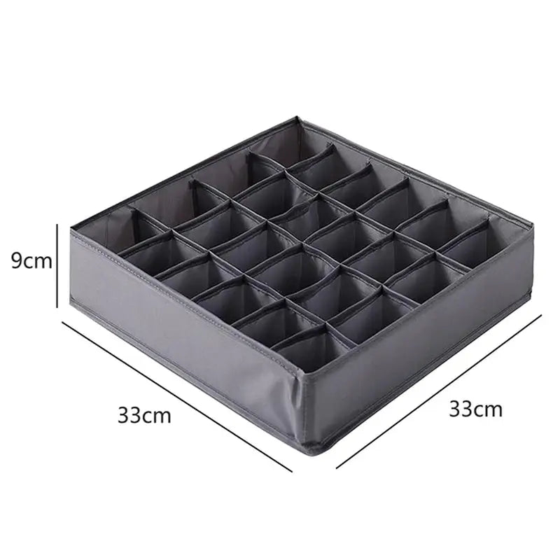 a close up of a black plastic tray with compartments