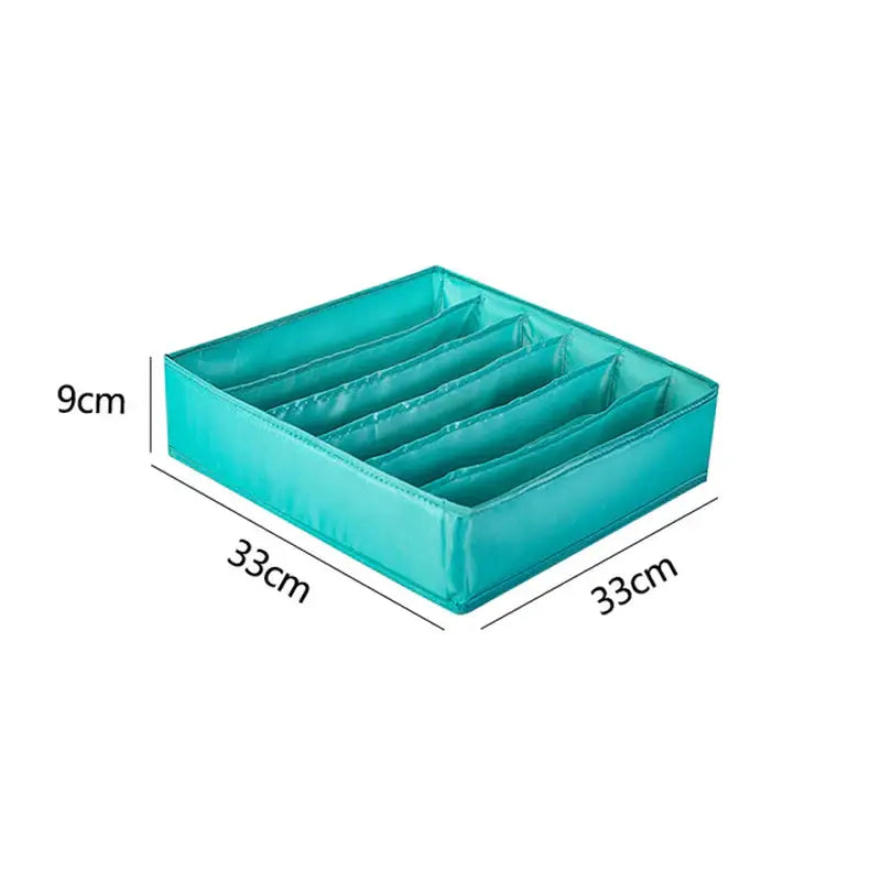 a teal green storage box with three compartments