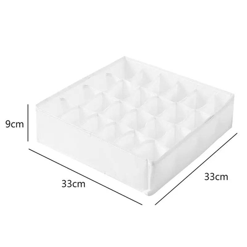 a white plastic drawer organizer with three compartments