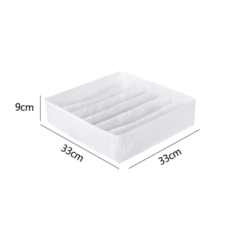 a white plastic drawer organizer with three compartments