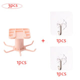 three pieces of pink plastic hooks with a white background