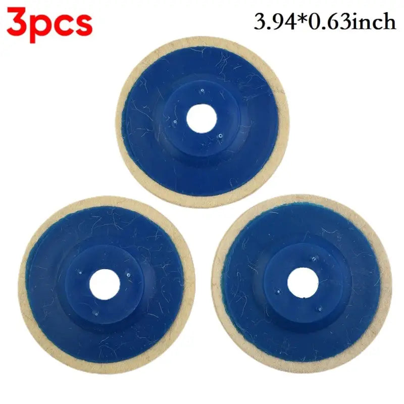 three blue and white discs with a hole in the middle