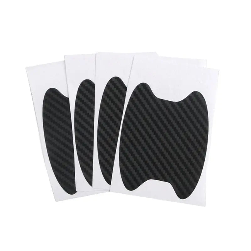 three black and white stickers with a black design on them