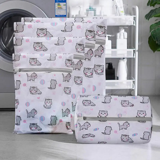 three bags with cat print on them