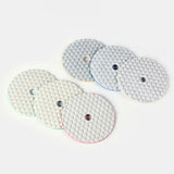 three white and red pads with holes on them