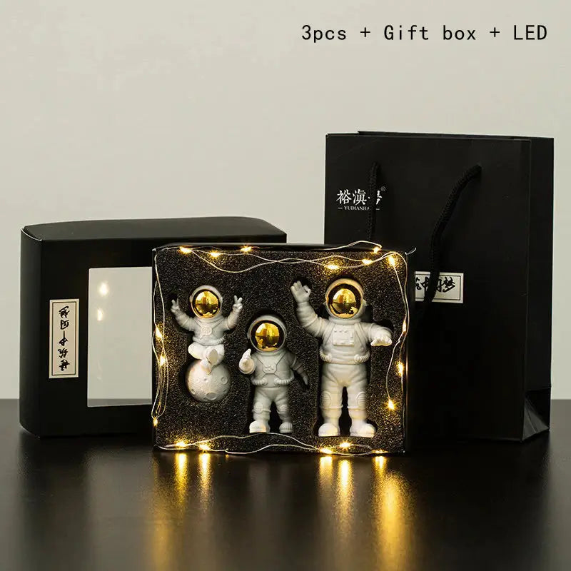 a couple of astronauts in a box with lights