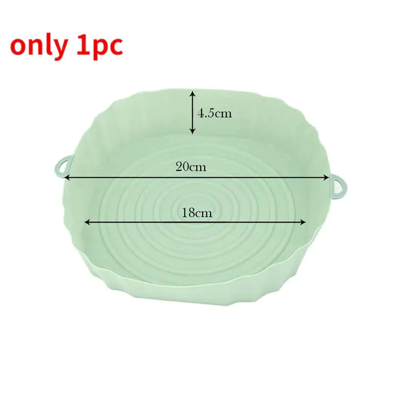 a green bowl with measurements for the bowl