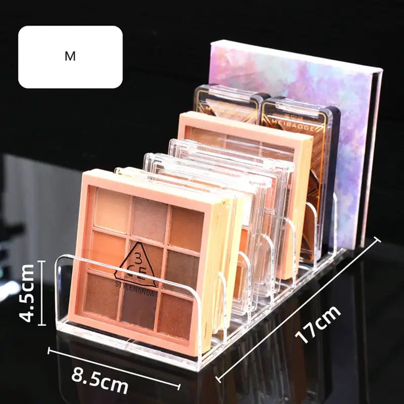 a close up of a display of various makeup products on a table