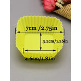 a yellow cupcake liner with measurements