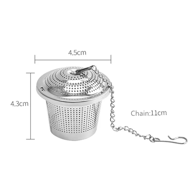 a close up of a tea strainer with chain attached