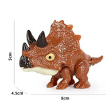a small toy with a brown and white dinosaur