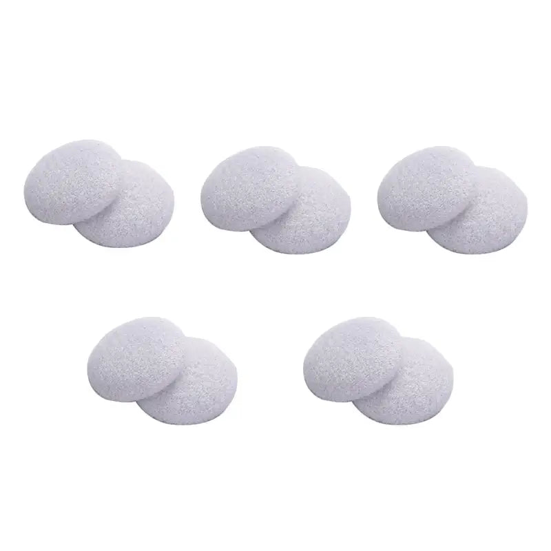 a set of four white foam balls