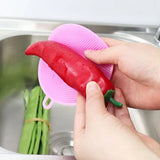 a person cleaning a sink with a sponge