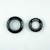 a pair of black plastic rings with a white background