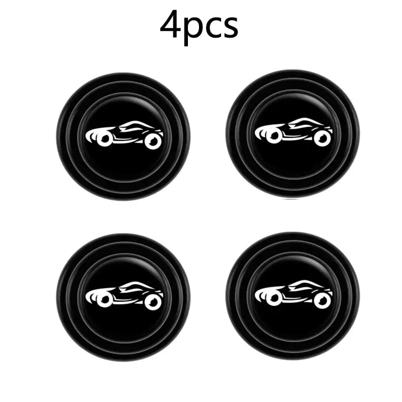 four black buttons with a white car on them