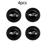 four black buttons with a white car on them