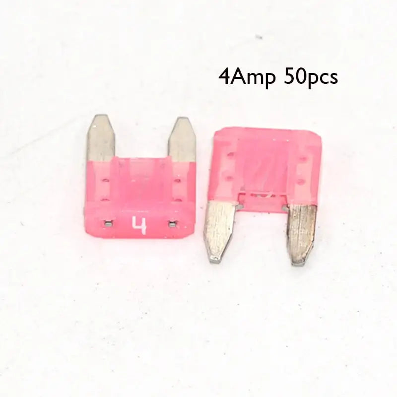 a pair of pink plastic clips with a white background