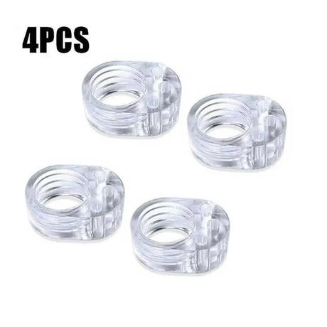 four clear plastic rings with a white background