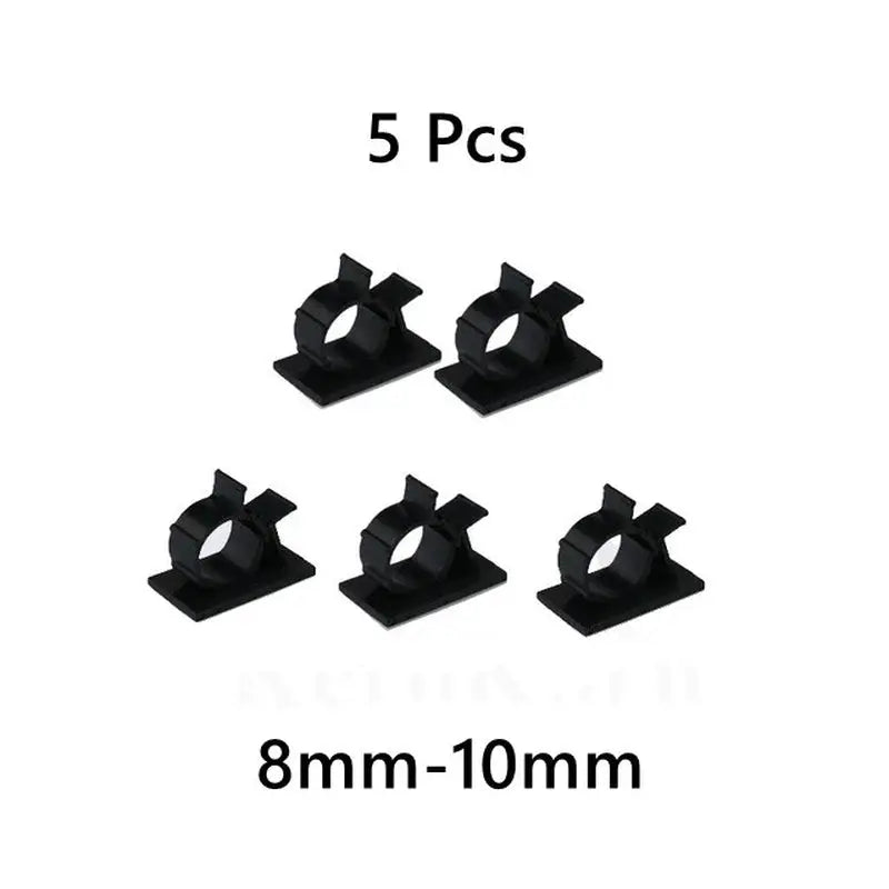 a set of five black plastic clips with a white background