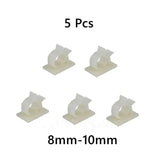 a close up of a bunch of white plastic clips on a white background