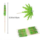 a green leaf and a wooden stick with a white stick