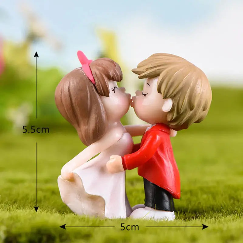a couple kissing in the grass