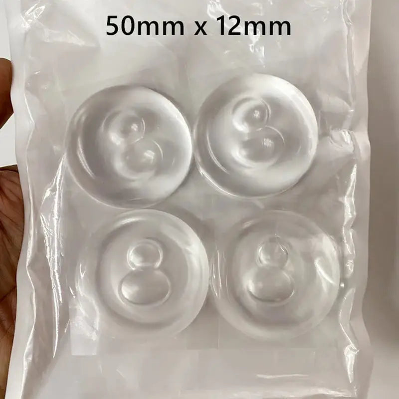 a package of plastic buttons in a white bag