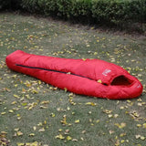 a sleeping bag on the ground in the yard