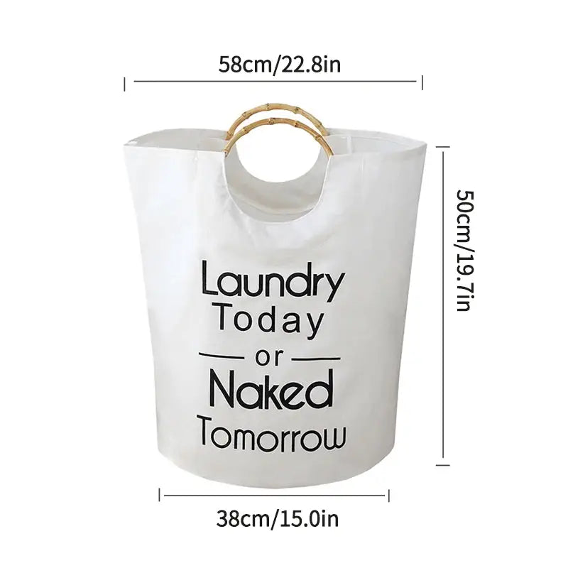 a white laundry bag with a bamboo handle and slogan