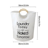 a white laundry bag with a bamboo handle and slogan