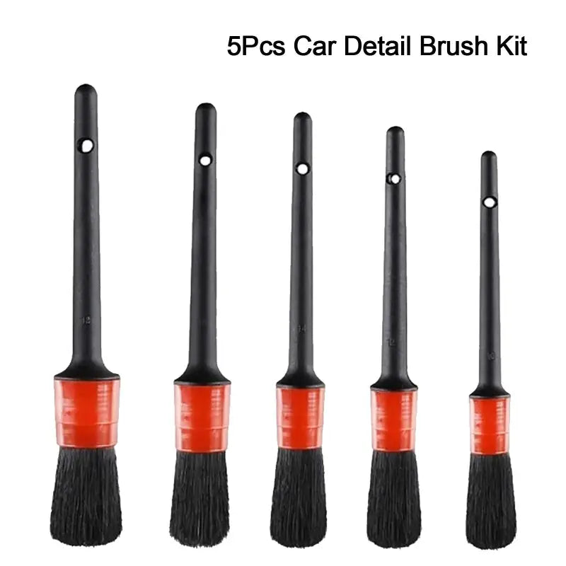 a set of four brushes with different colors and sizes
