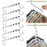 a set of clothes hangers hanging on a rail
