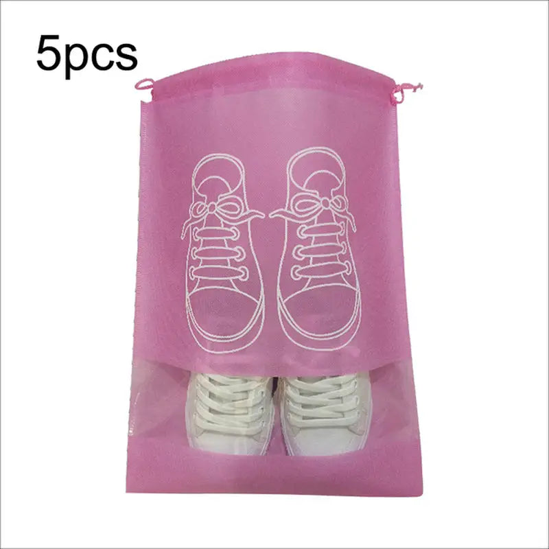 a pink bag with two pairs of shoes inside