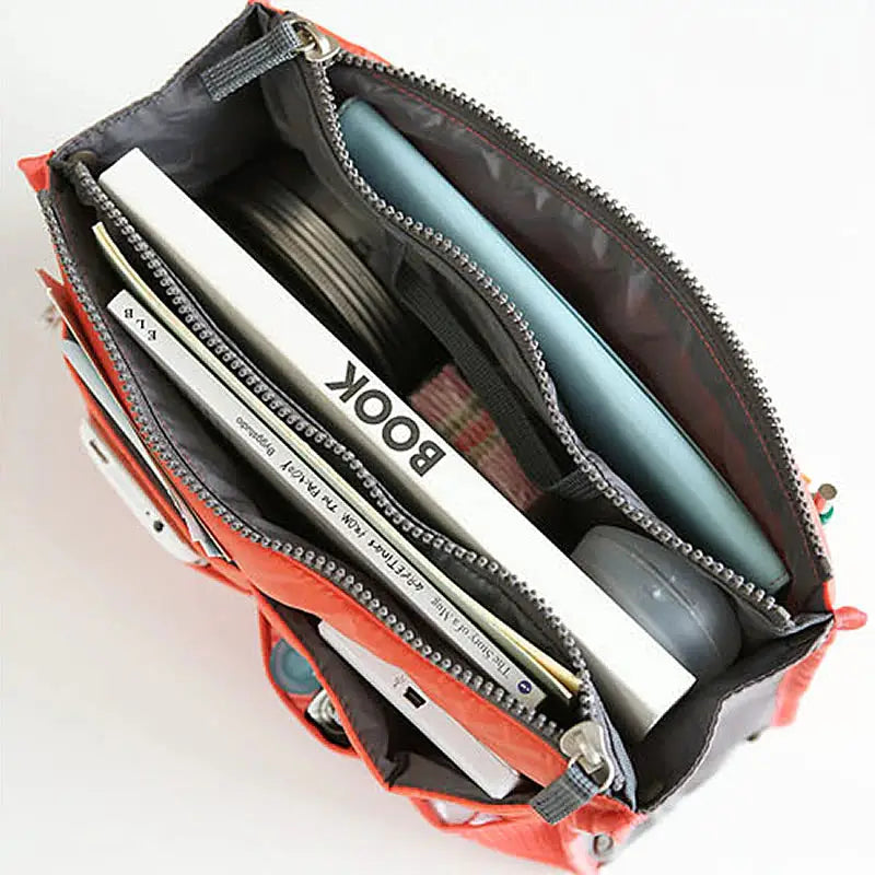 the inside of a purse with a wallet inside