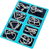 a set of silver metal rings on a blue background
