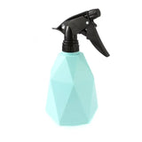 a spray bottle with a black trigger on a white background