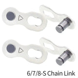two white plastic chain link with a black eye