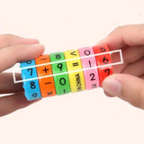 a hand holding a colorful plastic number line