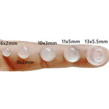 a close up of a person’s finger with a lot of different sizes of contact lenses