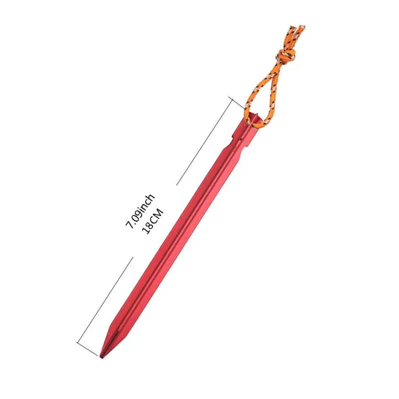 a close up of a red pen with a rope on it