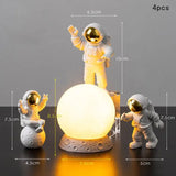 the astronaut lamp is shown with the astronaut and the moon