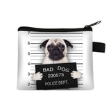 a pug dog holding a sign that says bad dog police